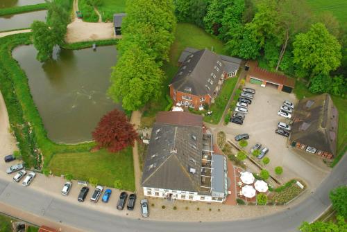 an aerial view of a house with a parking lot at Flair Landhotel Strengliner Mühle in Pronstorf
