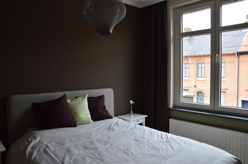 Un pat sau paturi într-o cameră la Vakantiehuis Jeanne Panne