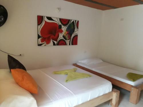 Una cama o camas en una habitación de Hostel Cattleya