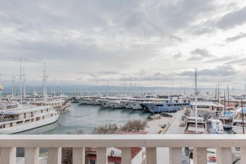 a bunch of boats docked in a marina at Hotel Krilo in Podstrana