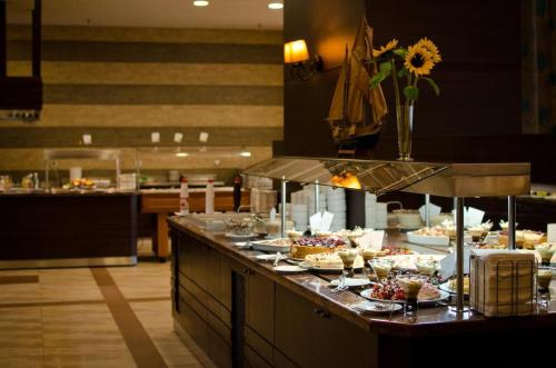 a buffet line with many food items on it at Pravets Resort Apartments in Pravets