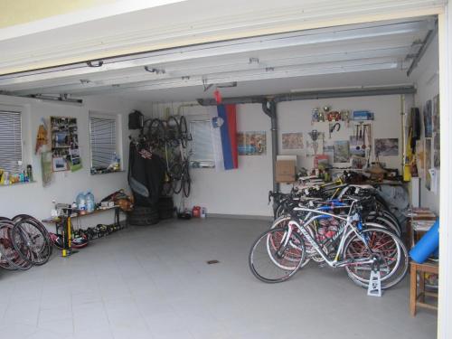 a garage with a bunch of bikes parked in it at Apartment Sobe Ravbar in Novo Mesto
