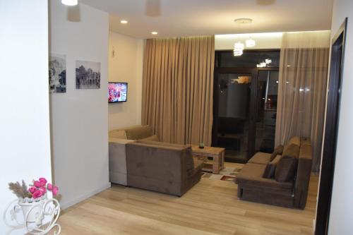 a living room with a couch and a chair at SaBa Apartments in Old Tbilisi in Tbilisi City