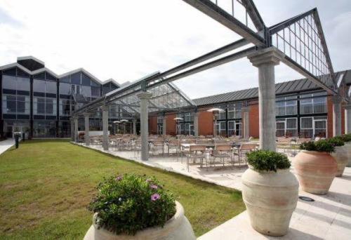 a large building with some plants in front of it at Skaga Hotel in Hirtshals