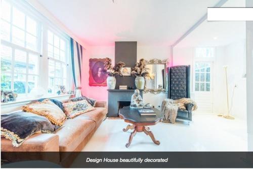 a living room with a couch and a table at Design B&B Naarden Vesting in Naarden
