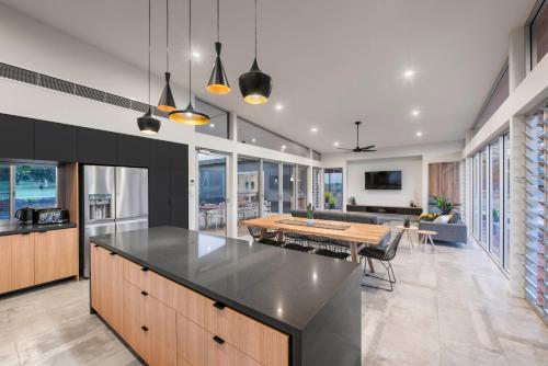 a kitchen with a table and a dining room at The Villas in Waikerie