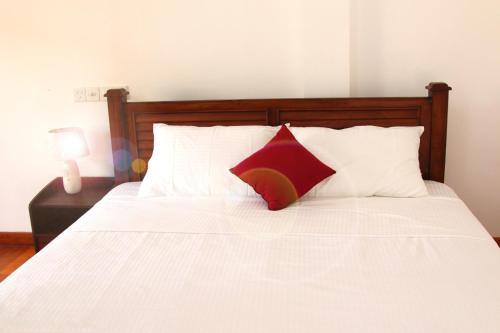 מיטה או מיטות בחדר ב-Himawari Beach Villa