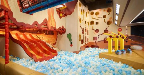 a large water play room with a water slide at Shangri-La Singapore in Singapore