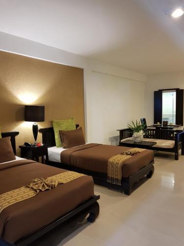 Cama o camas de una habitación en Siam Piman Hotel