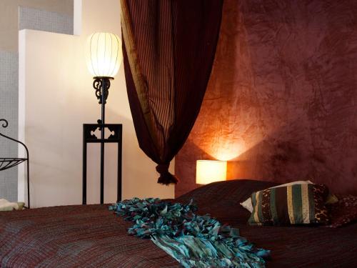 Ένα ή περισσότερα κρεβάτια σε δωμάτιο στο The rooms Bed & Breakfast