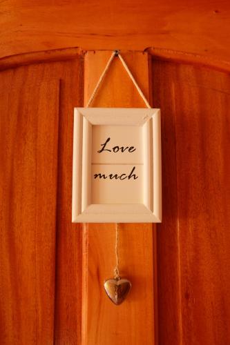 a sign that says love march hanging on a door at Michelina Princess Guest House in Loboc