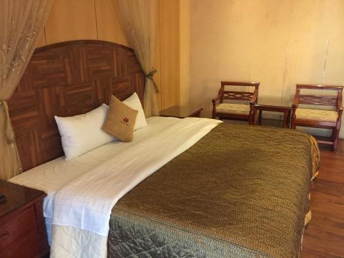 Ένα ή περισσότερα κρεβάτια σε δωμάτιο στο Charming Motel