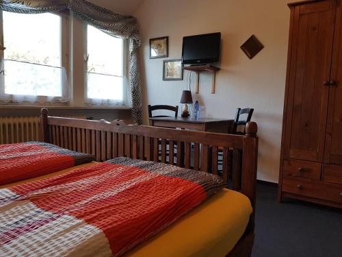 Postel nebo postele na pokoji v ubytování Pension 'Das kleine Landhaus'