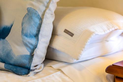 a pillow sitting on top of a bed at Million Dollar Views in Hobart