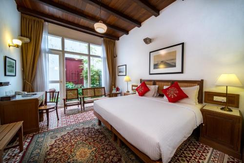 Säng eller sängar i ett rum på Nam Keng Hotel Penang