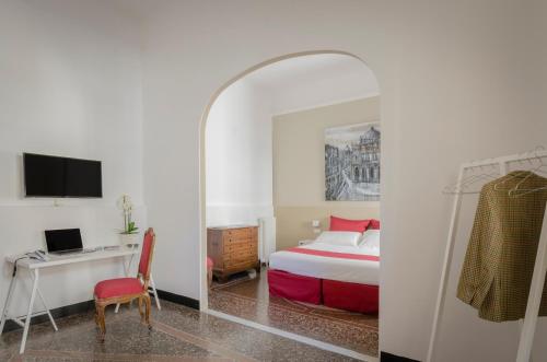 Säng eller sängar i ett rum på Genova46 Suites & Rooms