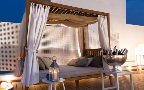 a living room with a couch with a canopy at La Dimora delle Fate Luxury & SPA in Miggiano
