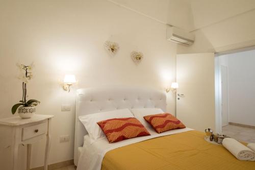 Un pat sau paturi într-o cameră la Palazzo Rattazzi