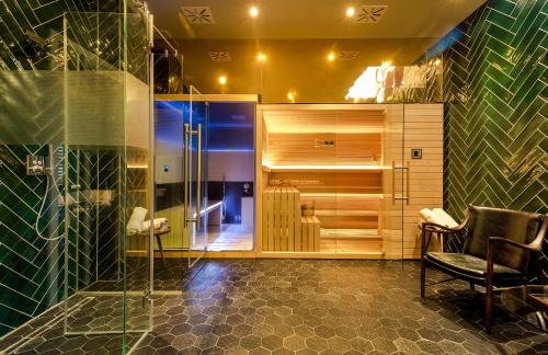 a bathroom with a sink and a toilet at Hotel Brown Beach House & Spa in Trogir