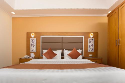 En eller flere senge i et værelse på Hotel Ritaj Alsahel