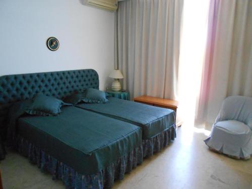 Säng eller sängar i ett rum på CASTILLO DE SANTA CLARA 2