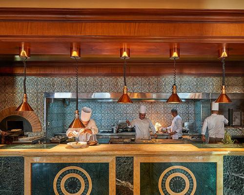 a group of chefs preparing food in a kitchen at Four Seasons Hotel Cairo at Nile Plaza in Cairo