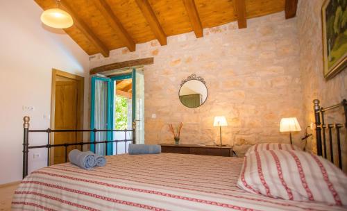a bedroom with a large bed in a room at Villa Medvidići in Rajki
