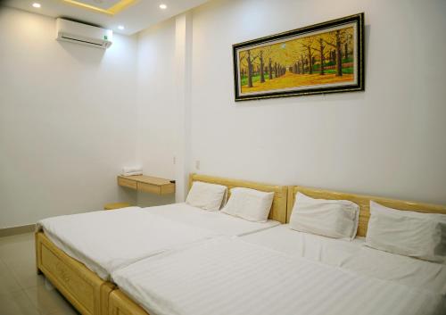 Giường trong phòng chung tại Khoi Nguon