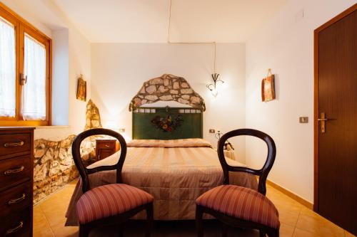 Postel nebo postele na pokoji v ubytování Agriturismo Lillastro