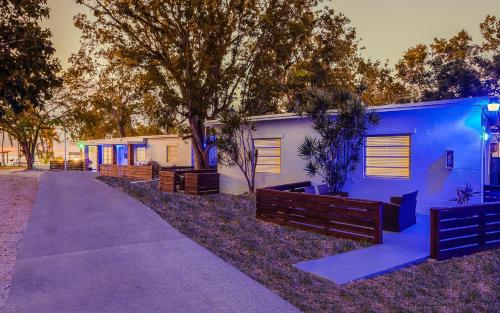 a walkway leading to a building with blue lights at Drift Hotel in Key Largo