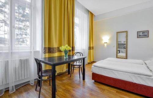 Postel nebo postele na pokoji v ubytování Apartments Central Park Marienbad