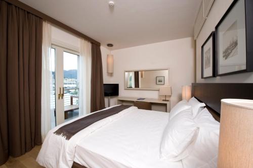 Postel nebo postele na pokoji v ubytování Marina Place Resort