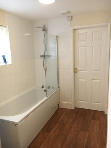 a bathroom with a bath tub and a shower at Albion House in Doncaster