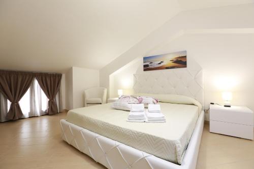 Posteľ alebo postele v izbe v ubytovaní Casa Vacanza Il Dromone