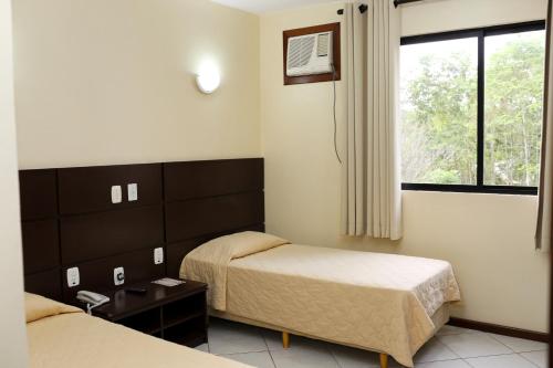 Katil atau katil-katil dalam bilik di Elsenau Hotel