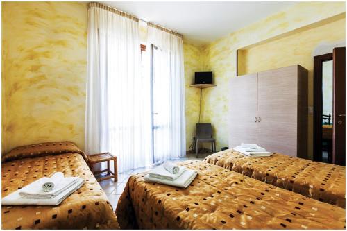 Un pat sau paturi într-o cameră la Guest House Il Faro