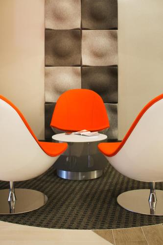 two chairs and a table in a room at ibis London Blackfriars in London