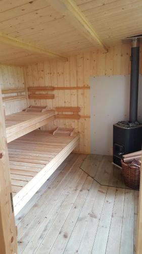 a wooden cabin with two bunk beds in it at Sieben-Berge-Haus in Brüggen