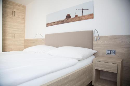 Llit o llits en una habitació de Gästehaus Pusztablick