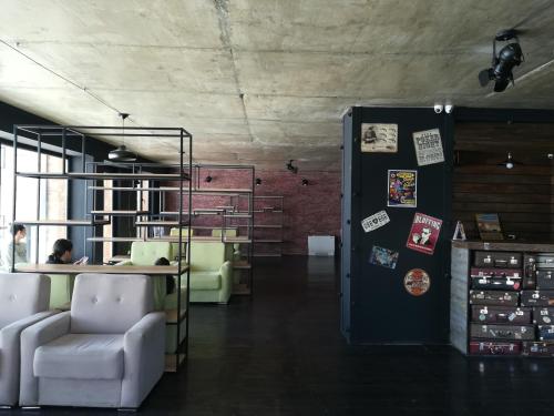 a room with a desk and chairs in a room at Apartment N503 Gudauri Loft in Gudauri