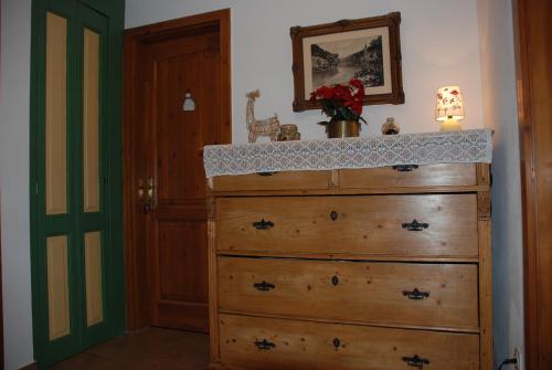 a dresser in a room with a wooden dresser at Hungária Vendégház in Eger