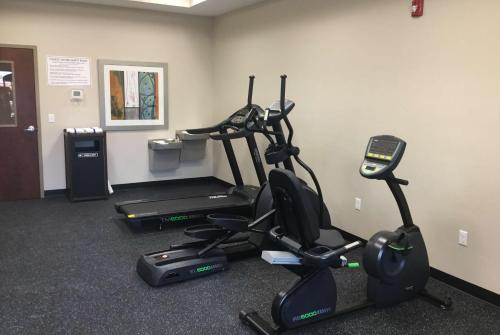 a gym with two exercise bikes and a treadmill at Baymont by Wyndham Page Lake Powell in Page