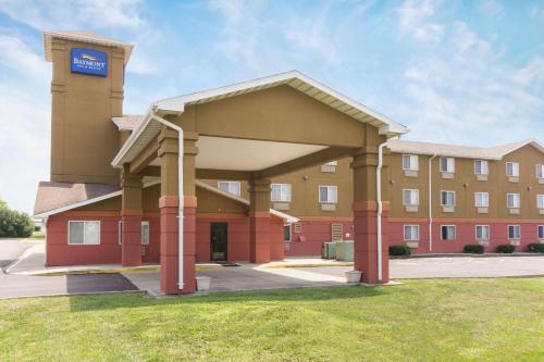 a hotel building with a large building at Baymont Inn & Suites by Wyndham Huber Heights Dayton Northeast in Huber Heights
