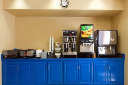 a blue counter top with appliances on top of it at Extend-a-Suites - Extended Stay, I-40 Amarillo West in Amarillo