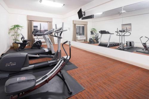 a gym with treadmills and ellipticals in a room at Baymont by Wyndham Savannah/Garden City in Savannah