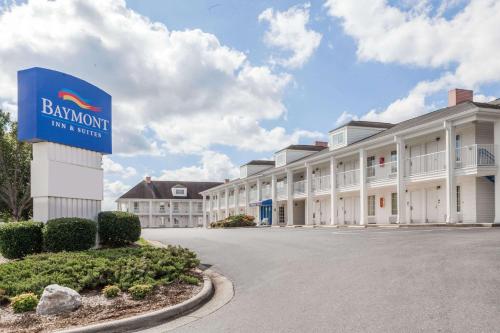 a building with a sign in front of it at Baymont by Wyndham Hickory in Hickory
