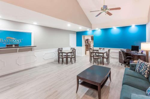 a waiting room with a couch and chairs and a table at Baymont by Wyndham Duncan/Spartanburg in Duncan