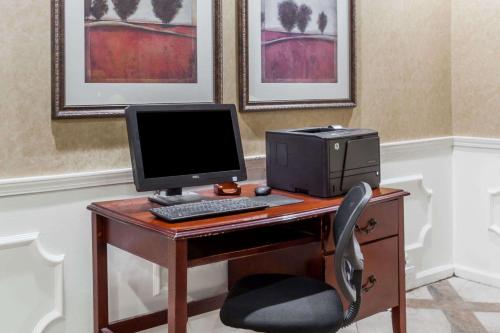a desk with a computer monitor and a printer at Baymont by Wyndham Hickory in Hickory