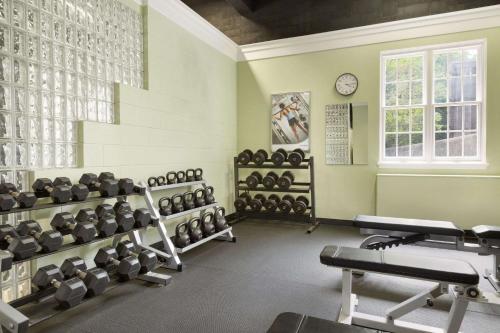 a gym with a lot of equipment in a room at Ivey Spencer Leadership Centre in London