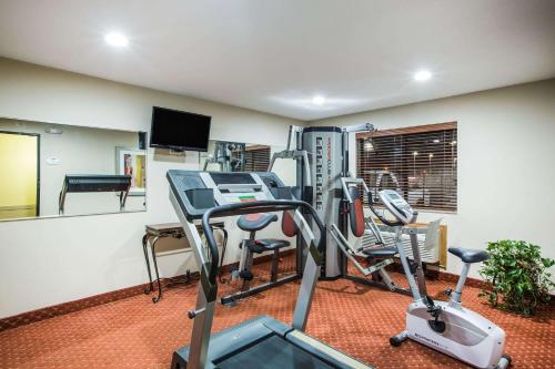a gym with two treadmills and a treadmill at Baymont by Wyndham Cedar Rapids in Cedar Rapids